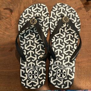 Tory Burch size 10 black and white flip flops.  Worn once.